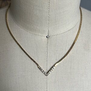Gold-tone necklace with V-shaped faux diamonds